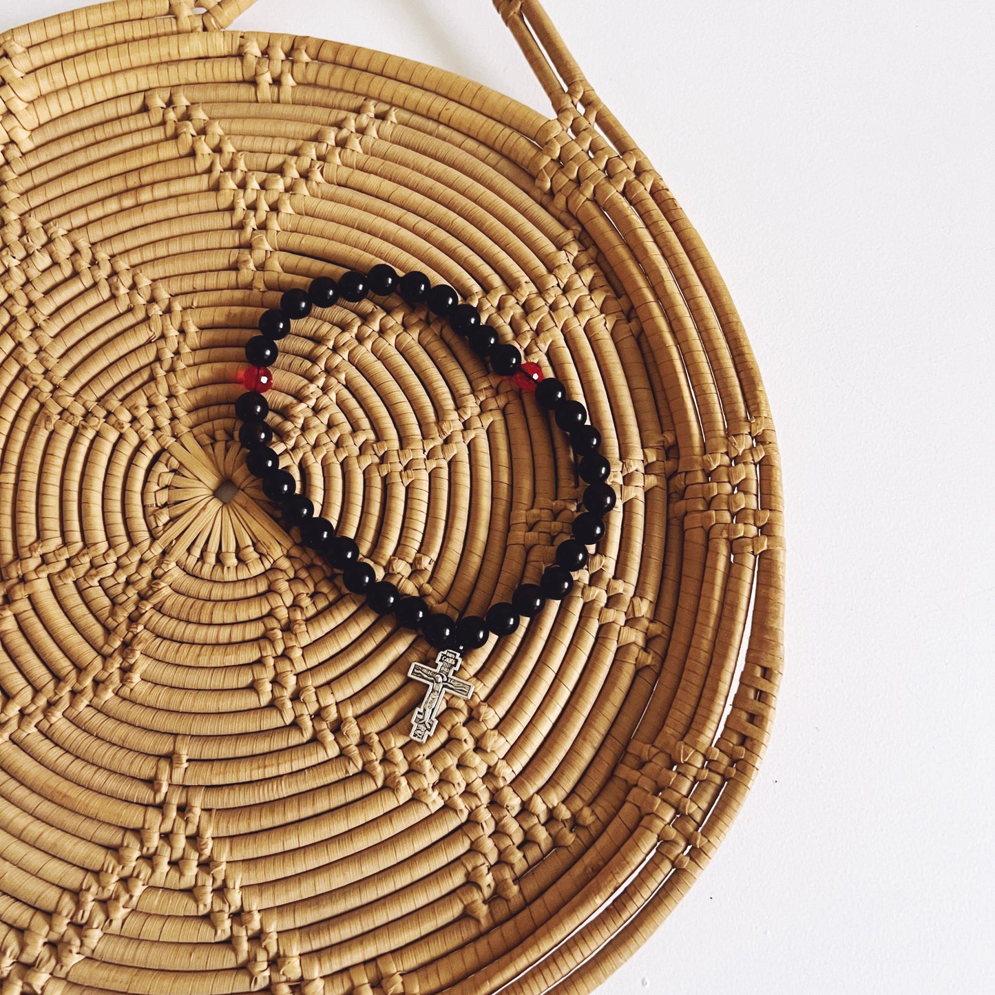 Ebony 33 Bead Prayer Bracelet with Red Spacers and Silver Crucifix